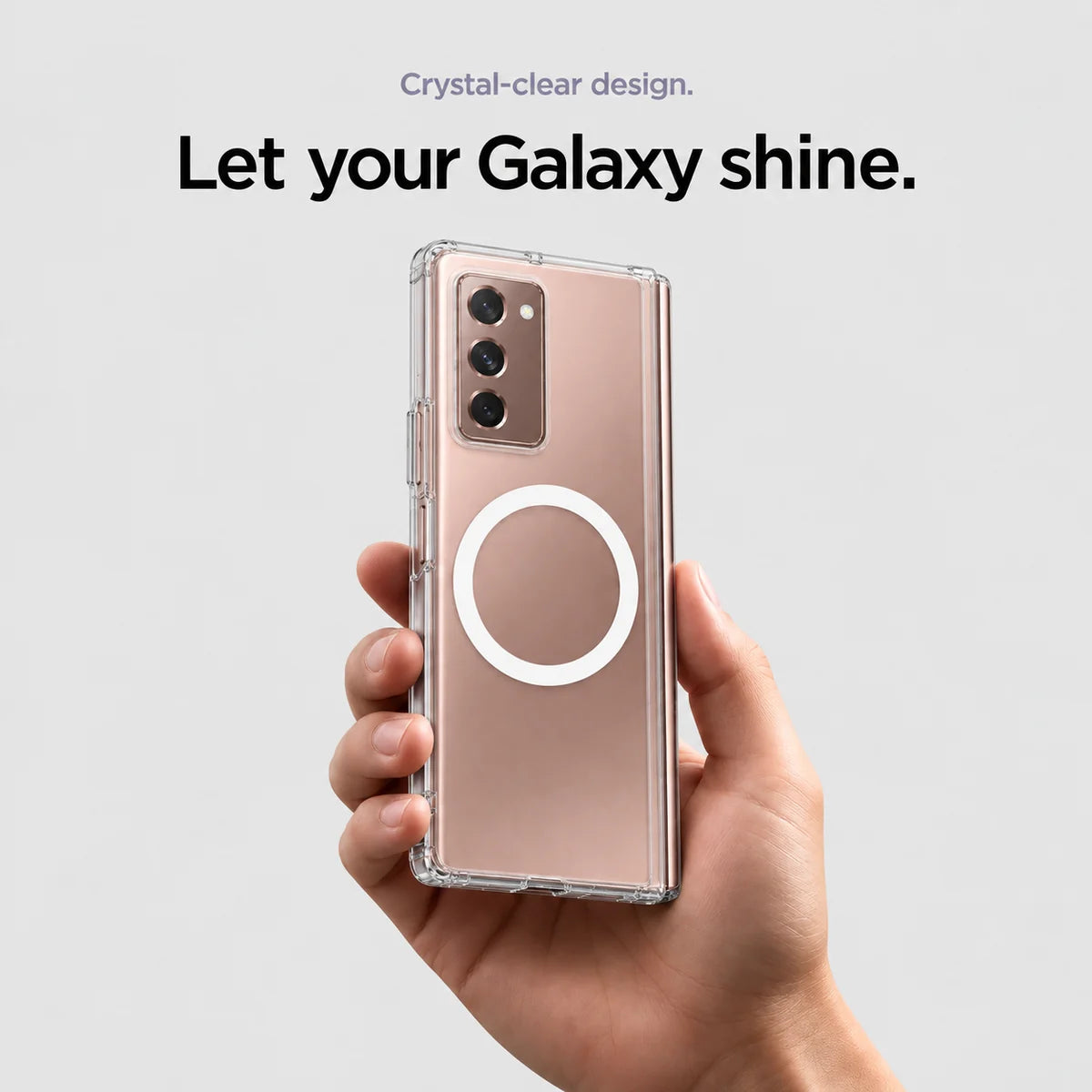 Clear magnetic phone case held at an angle, showing its transparent back and camera openings. #Samsung Model_Samsung Z Fold 2