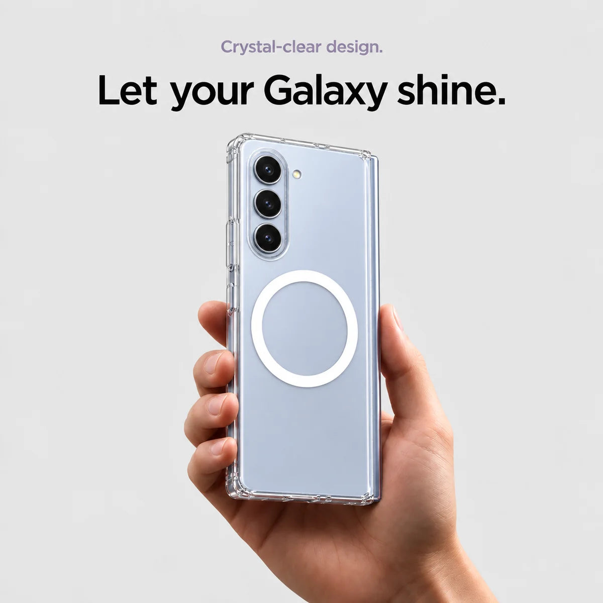 Clear magnetic phone case held at an angle, showing its transparent back and camera openings. #Samsung Model_Samsung Z Fold 5