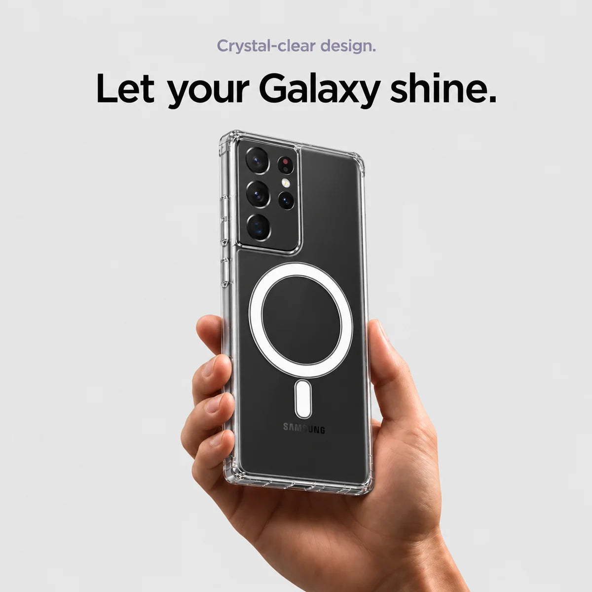 Clear magnetic phone case held at an angle, showing its transparent back and camera openings. #Samsung Model_Samsung S21 Ultra