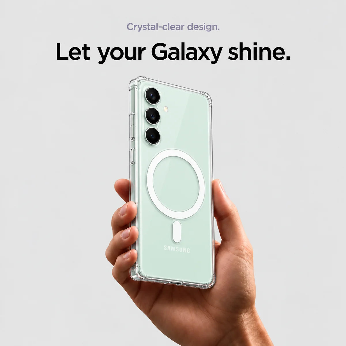Clear magnetic phone case held at an angle, showing its transparent back and camera openings. #Samsung Model_Samsung S23 FE